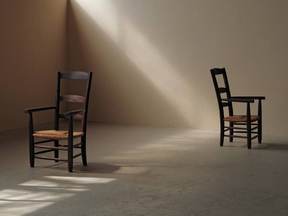 Pair of solid wood and straw armchairs, France, circa 1950.