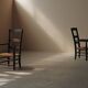 Pair of solid wood and straw armchairs, France, circa 1950.