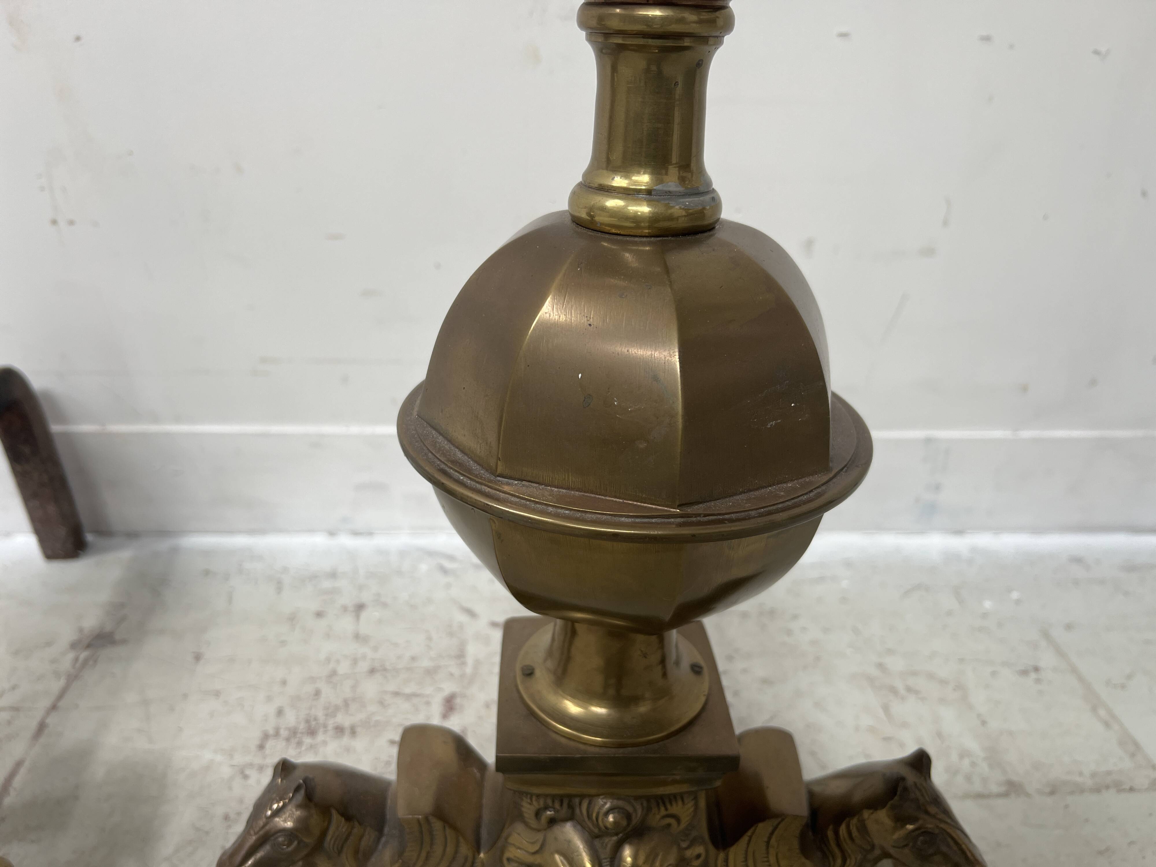 Important pair of brass log holders from the 20th century.