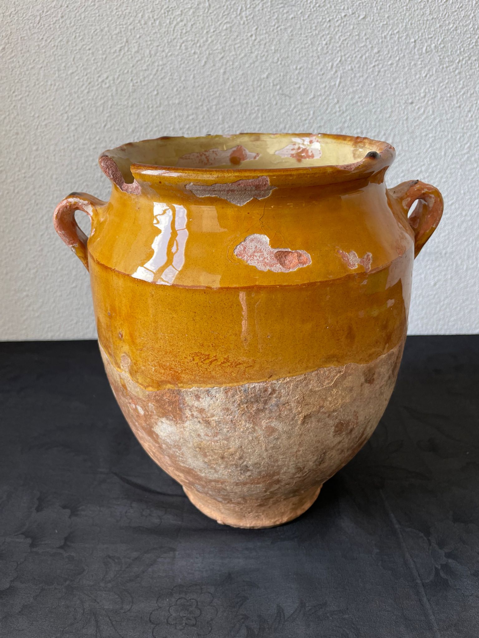 Old grease pot in glazed yellow terracotta, France nineteenth century