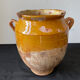 Old grease pot in glazed yellow terracotta, France nineteenth century