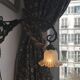 Art Nouveau wall light in wrought iron with vine decoration, early 20th century.