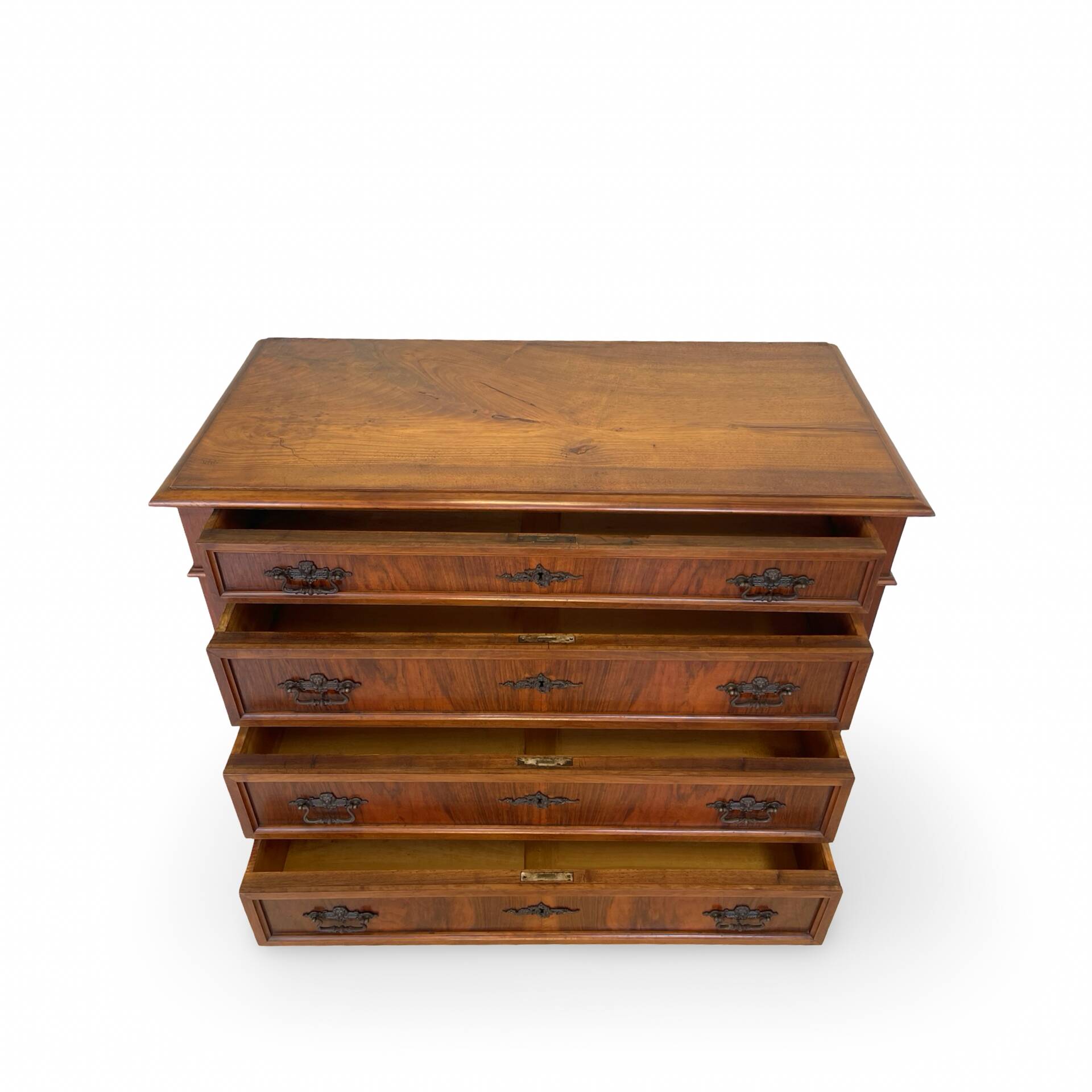 Antique walnut commode with bronze handles in the shape of a lion's mask,