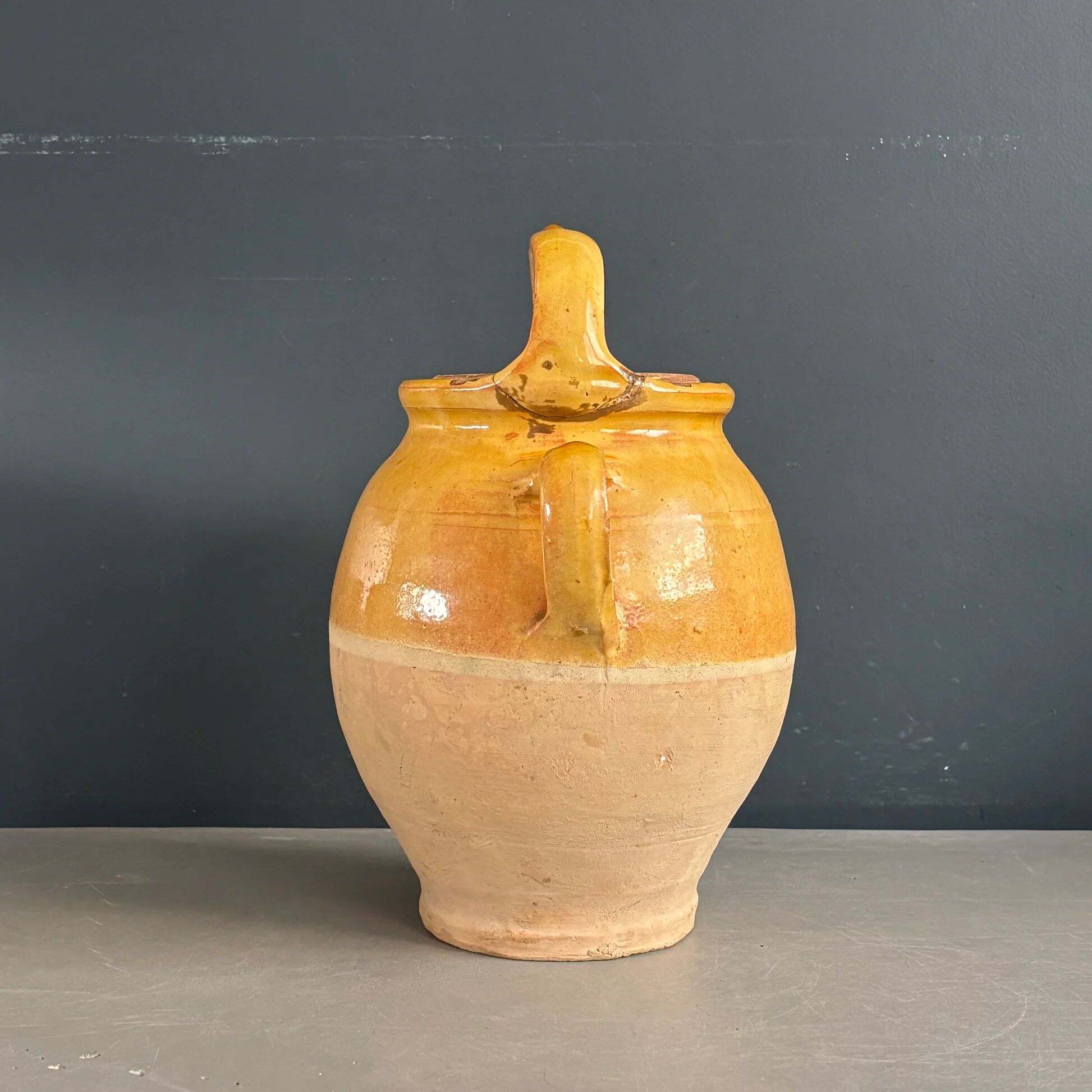 Ancient oil jar in glazed terracotta