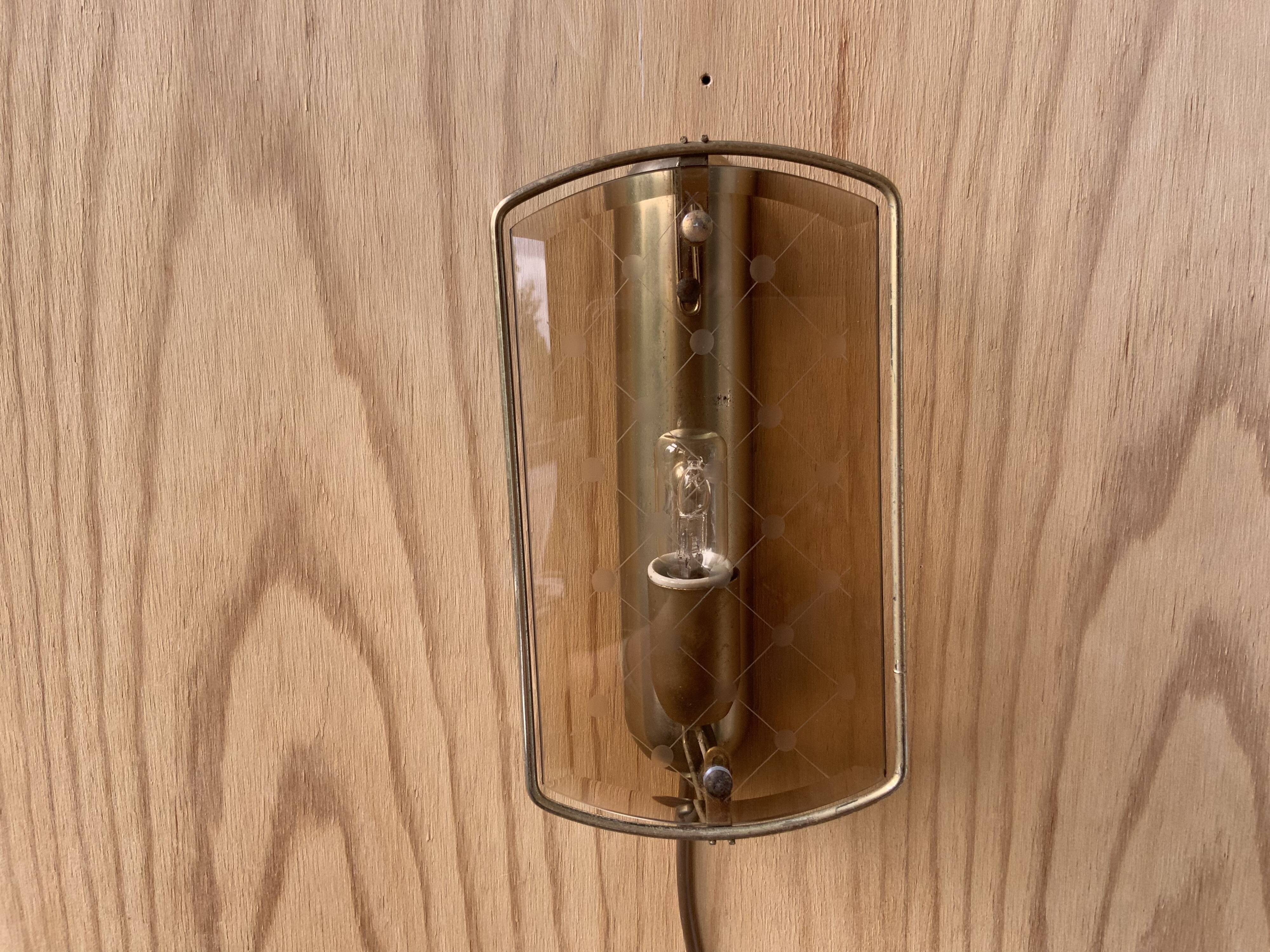 Brass wall lamp and smoked glass