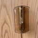 Brass wall lamp and smoked glass