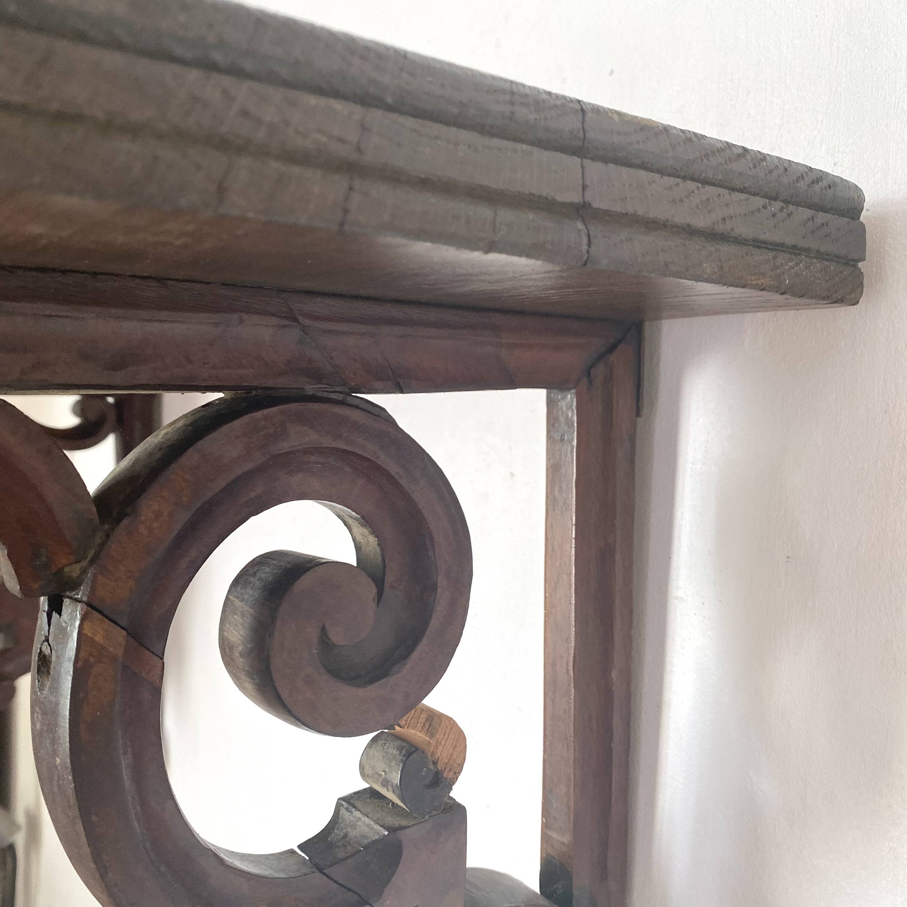 antique oak wall shelf with carved brackets