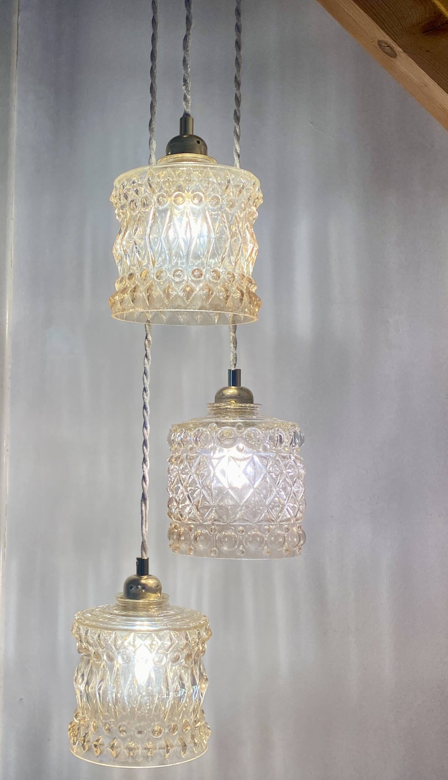 Triple antique globe pendant light in amber glass