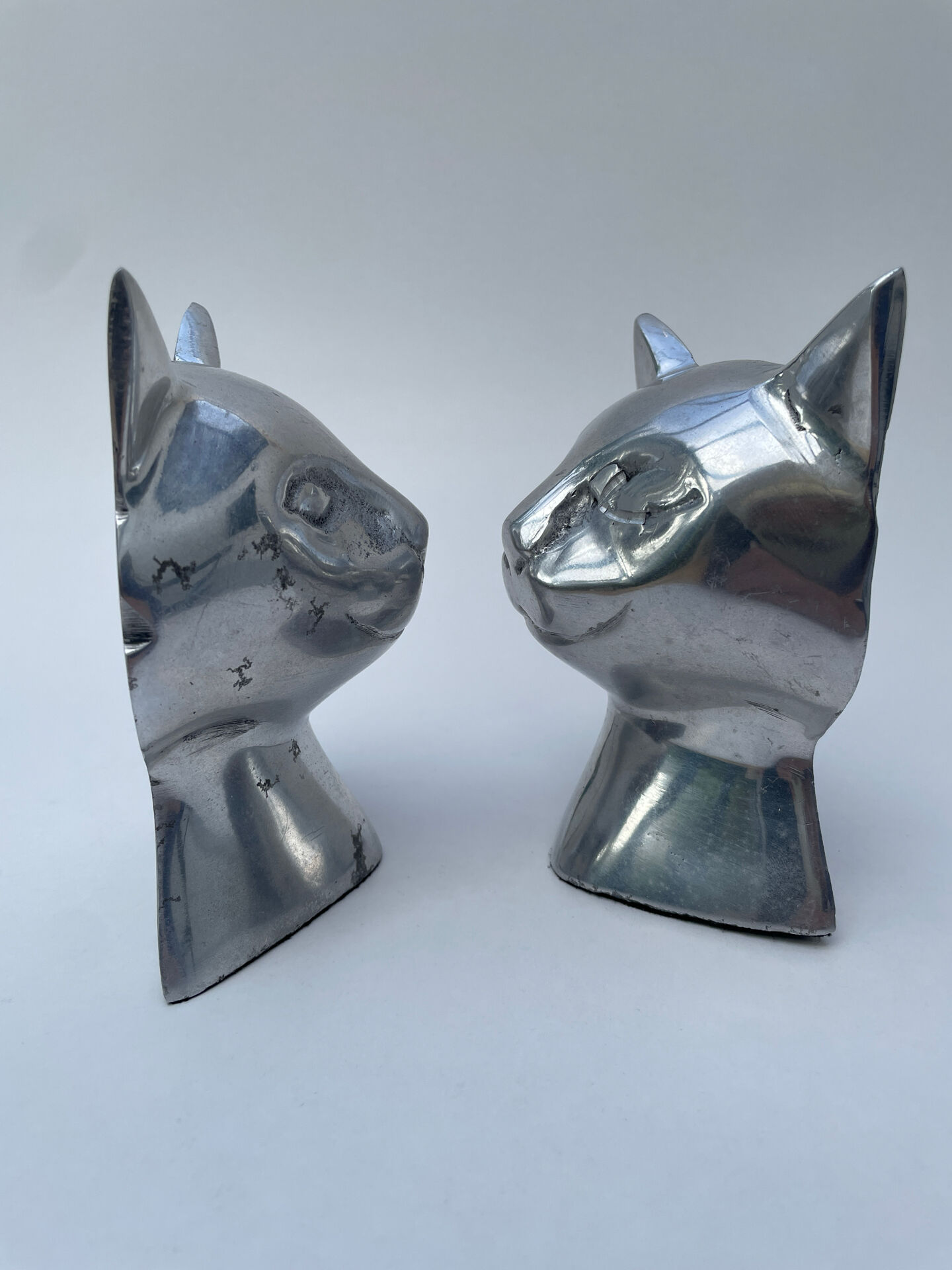 Pair of designer cat head bookends