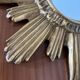 Vintage sun mirror in golden resin 60s/70s