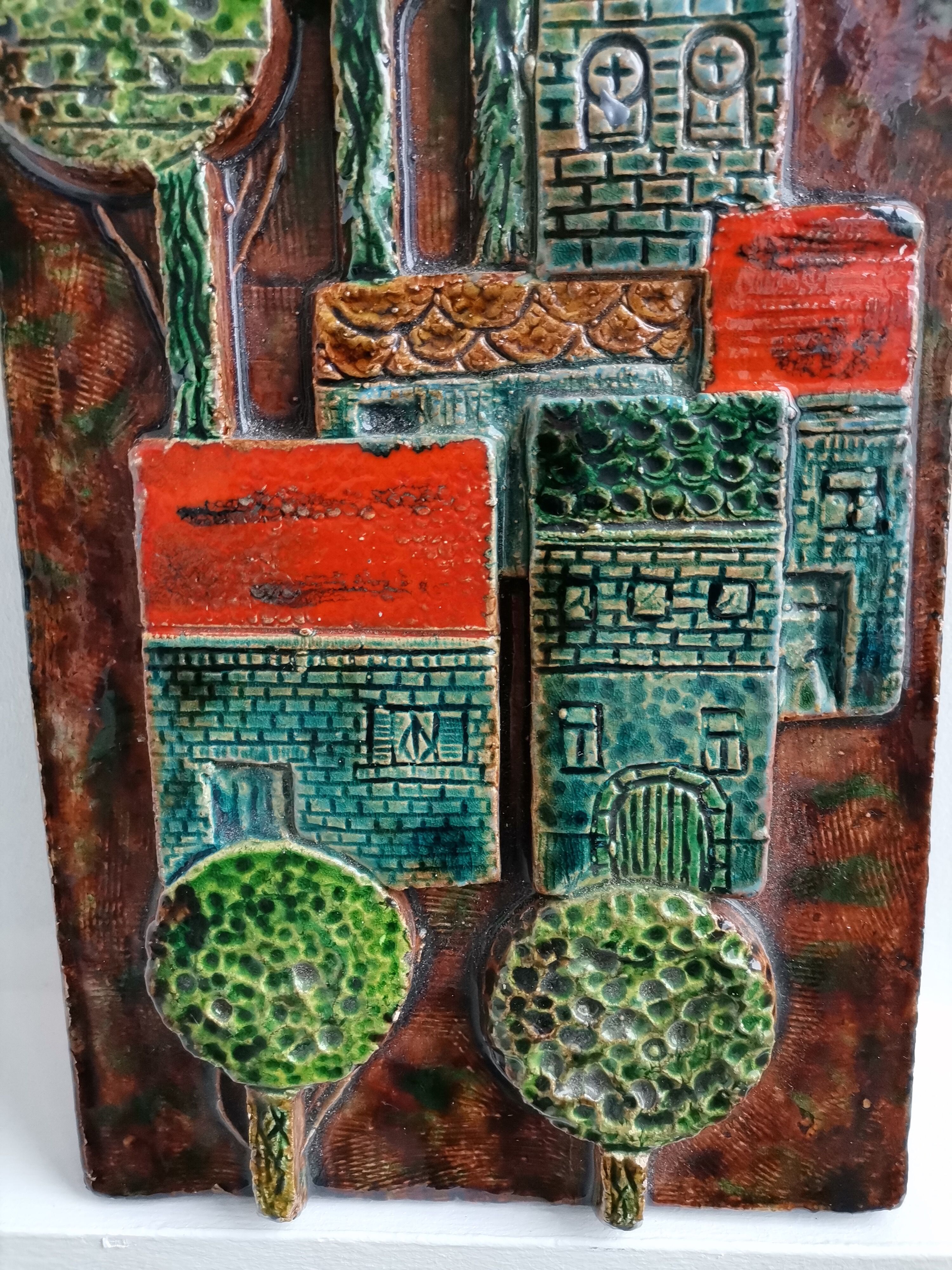 Decorative enamelled wall plate signed