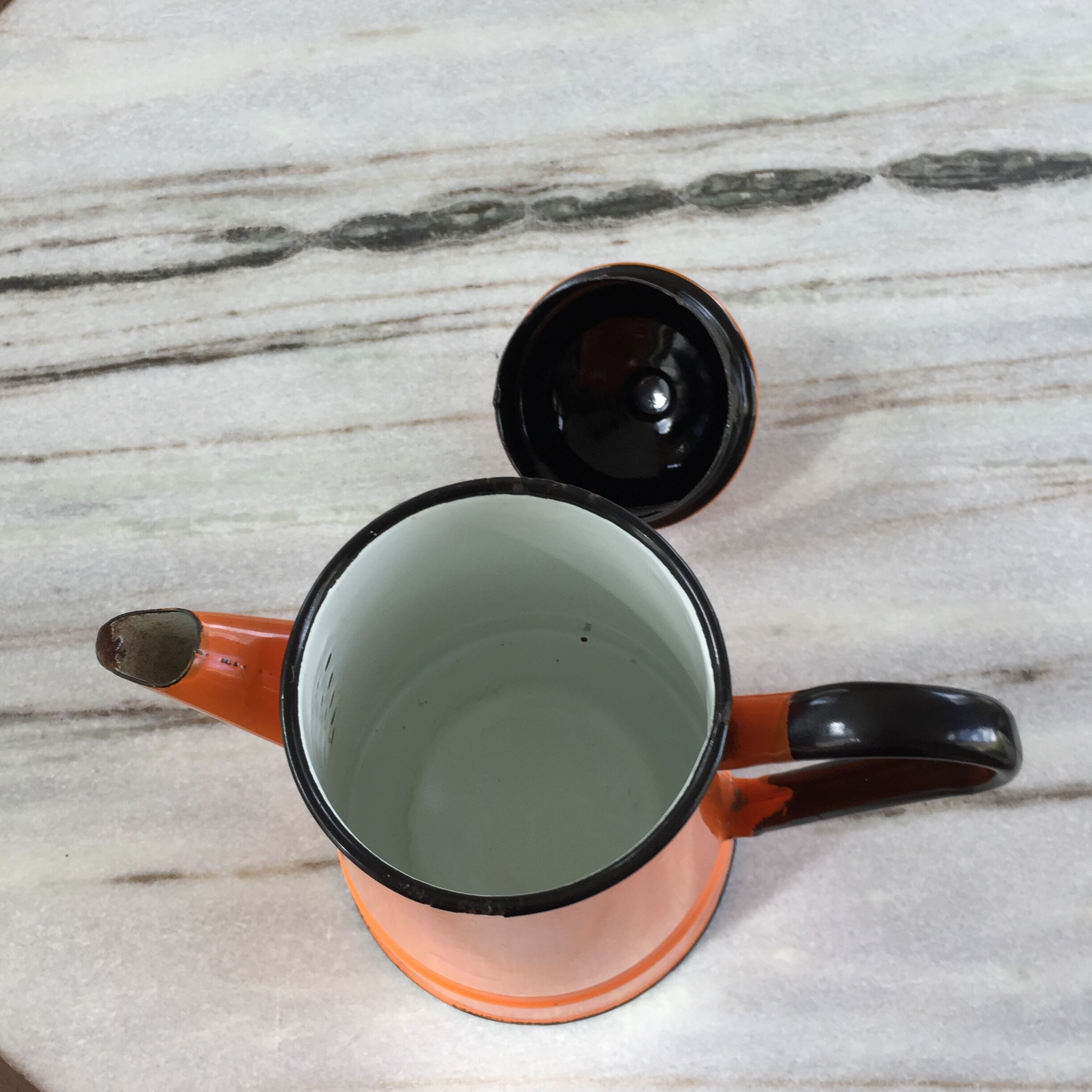 Orange and black enamelled sheet metal coffee maker