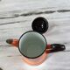 Orange and black enamelled sheet metal coffee maker