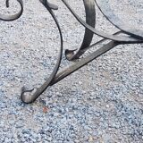 Table basse des années 70 en fer forgé plateau en verre bec de corbin
