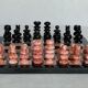 Small chessboard in coral marble and black marble - Italy - Second half of the twentieth century