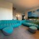 Set of 2 sofas and 2 poufs by Roche Bobois.