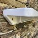 Antique wall shelf for bathroom in white porcelain.