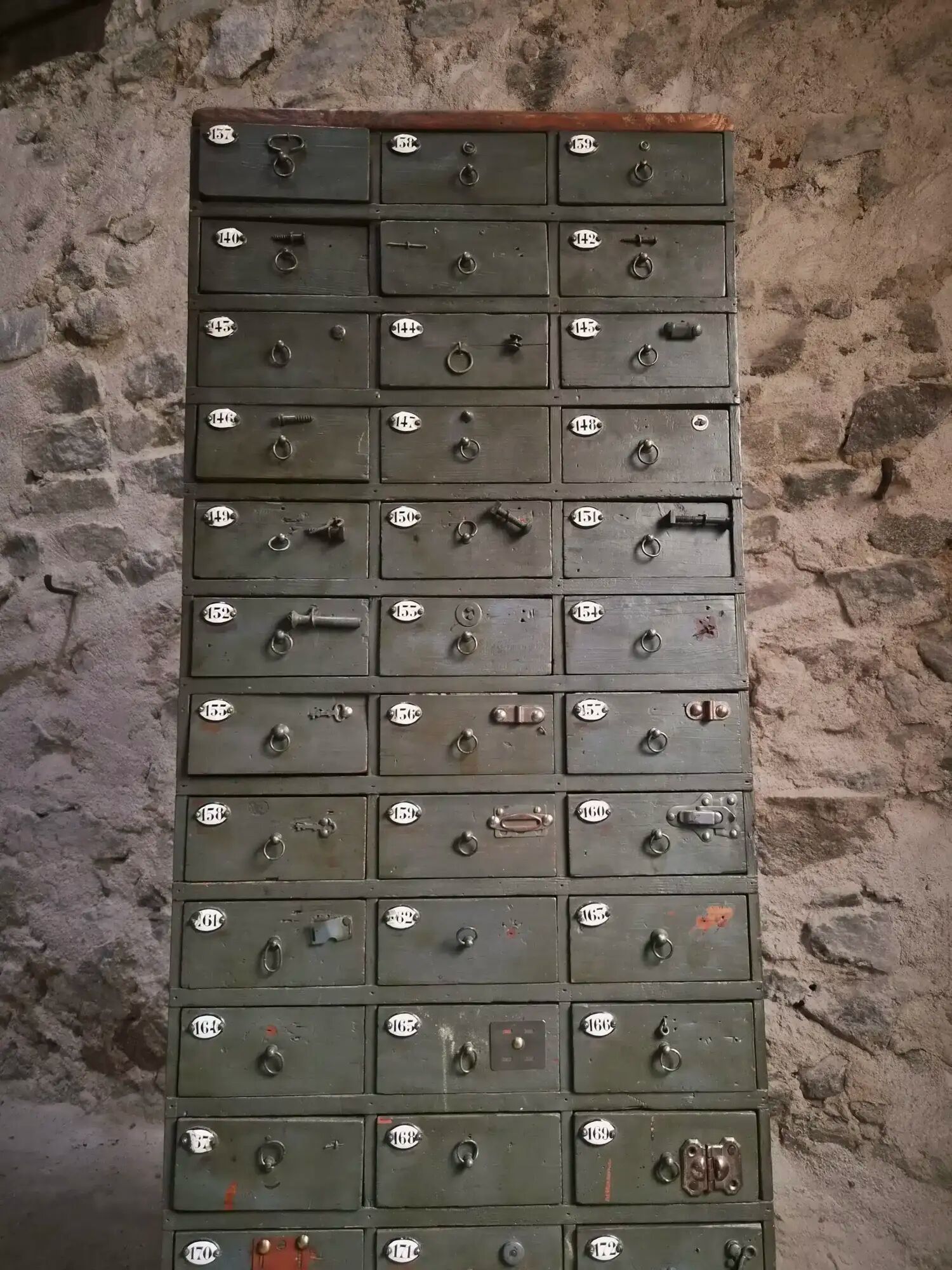Antique hardware cabinet with 48 drawers, circa 1900.