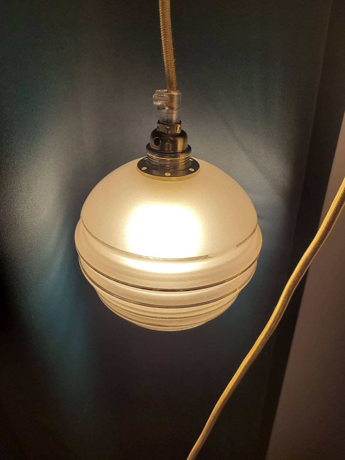 Frosted glass lamp with golden trims