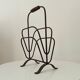 Brutalist wrought iron magazine rack from the 1960s.