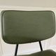 Vintage chair with green imitation leather armrests