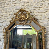 Mirror with parecloses with pediment, gilded with gold leaf