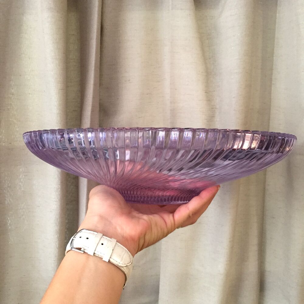 Twisted glass fruit cup of purplish pink color