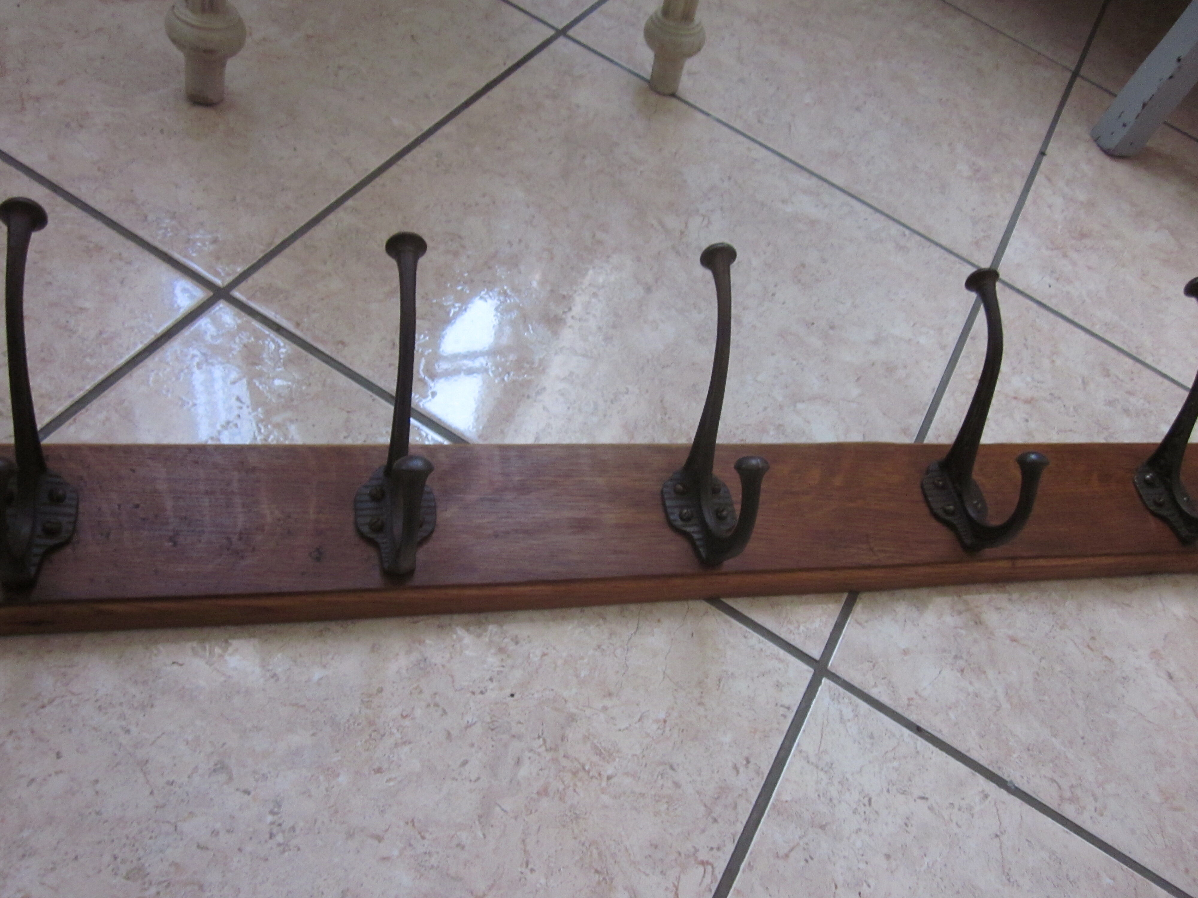 Bistro coat rack has 6 cast iron pads