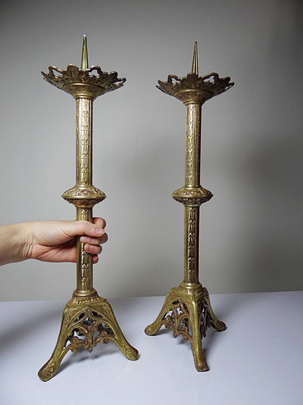 Large pair of antique gilded bronze candlesticks, Gothic style from the 19th century.