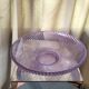 Twisted glass fruit cup of purplish pink color