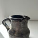 Patinated pitcher signed