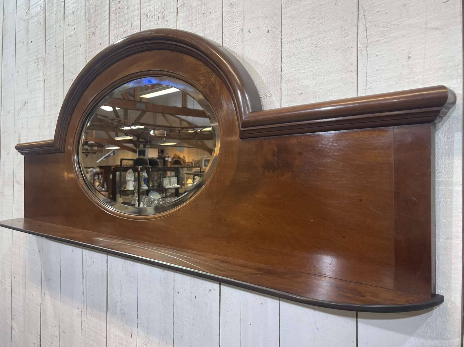 English mahogany shelf with its bevelled mirror from the early 20th century.