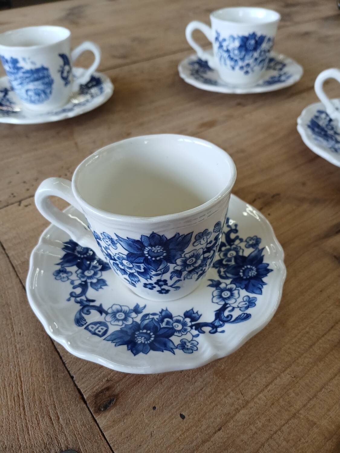 4 antique cups and saucers
