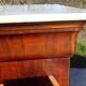 Antique mahogany chest of drawers with white marble.
