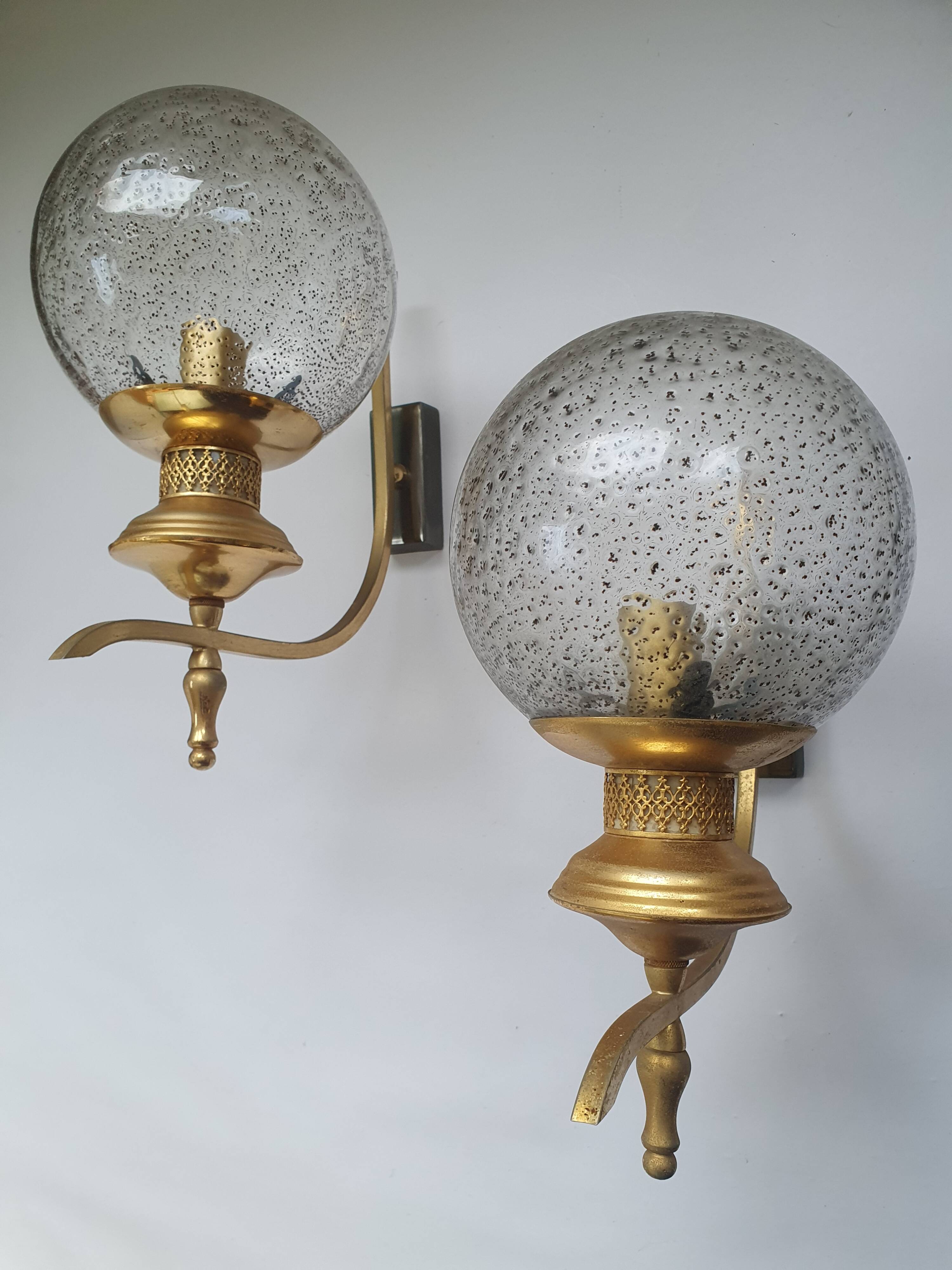 Pair of vintage gold wall sconces with transparent globes