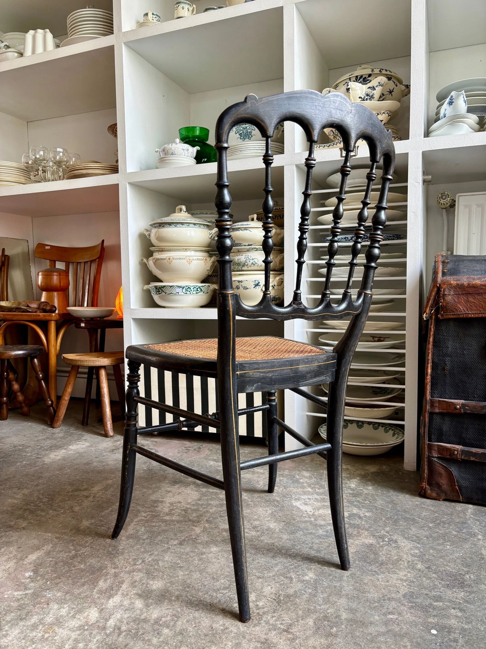 Napoleon III chair in black and gold wood with caning.