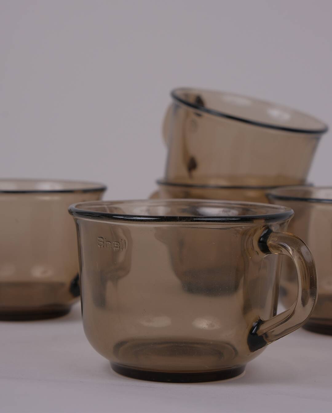 Smoked glass coffee cups x7