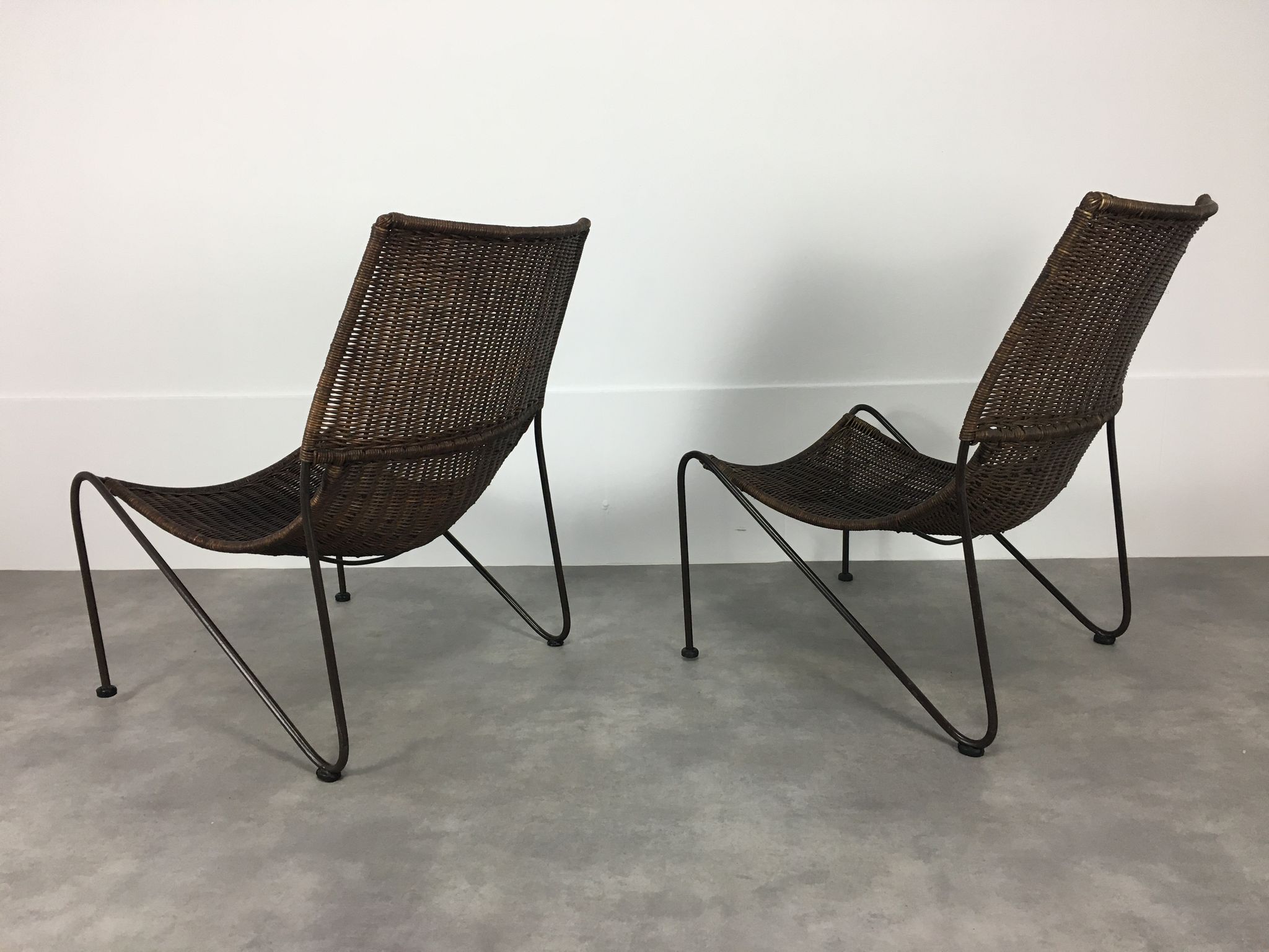Pair of rattan and steel wire armchairs by frederick weinberg