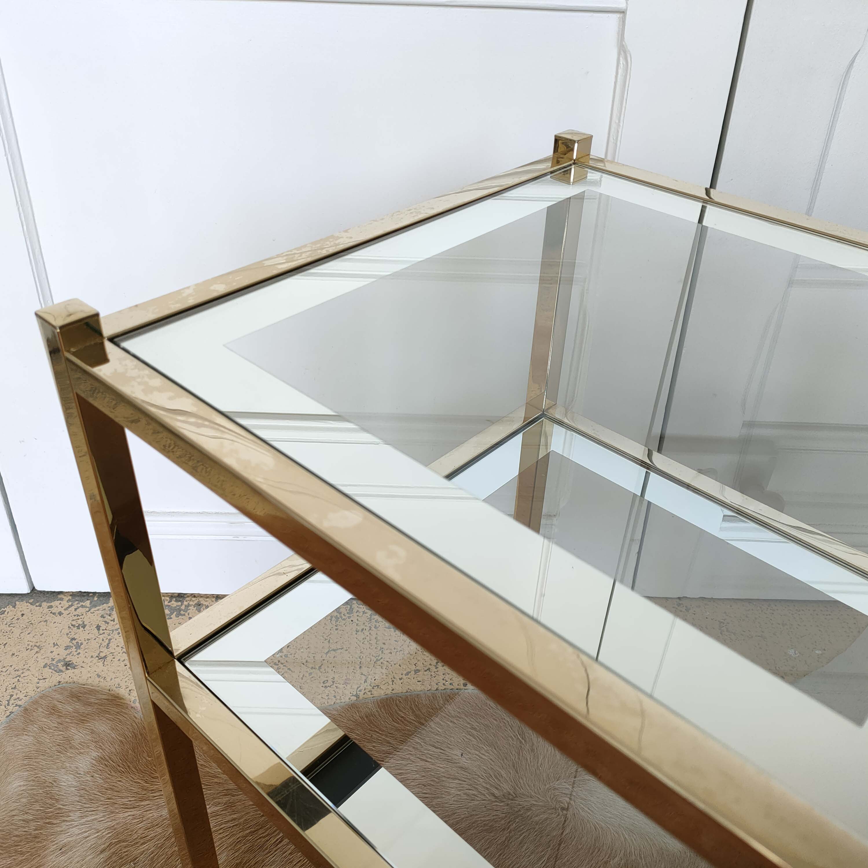 Golden sofa tip and mirror glass