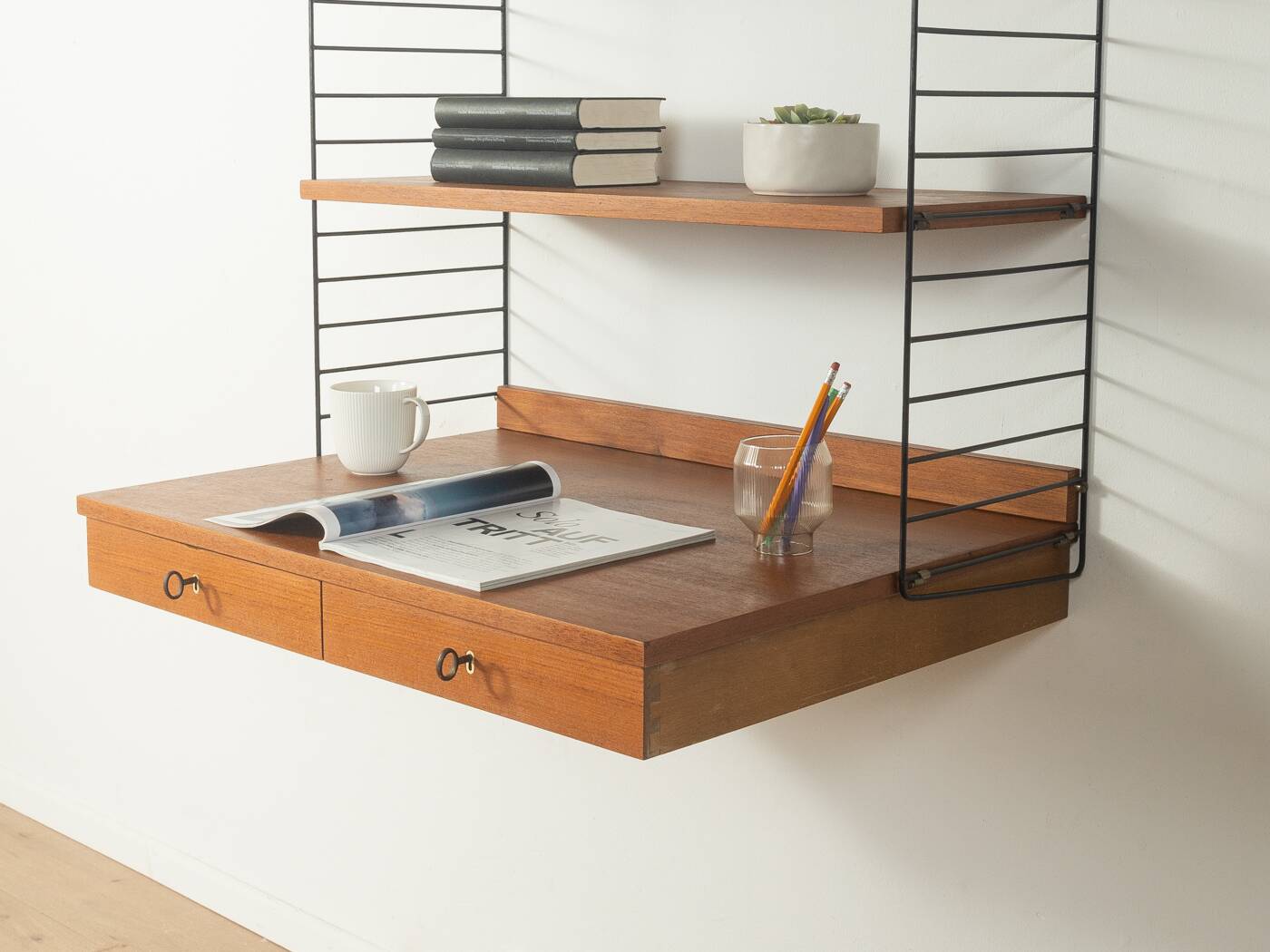 Original String shelf by Nils Strinning in teak veneer, 1949