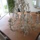 Large cage chandelier in aged metal.