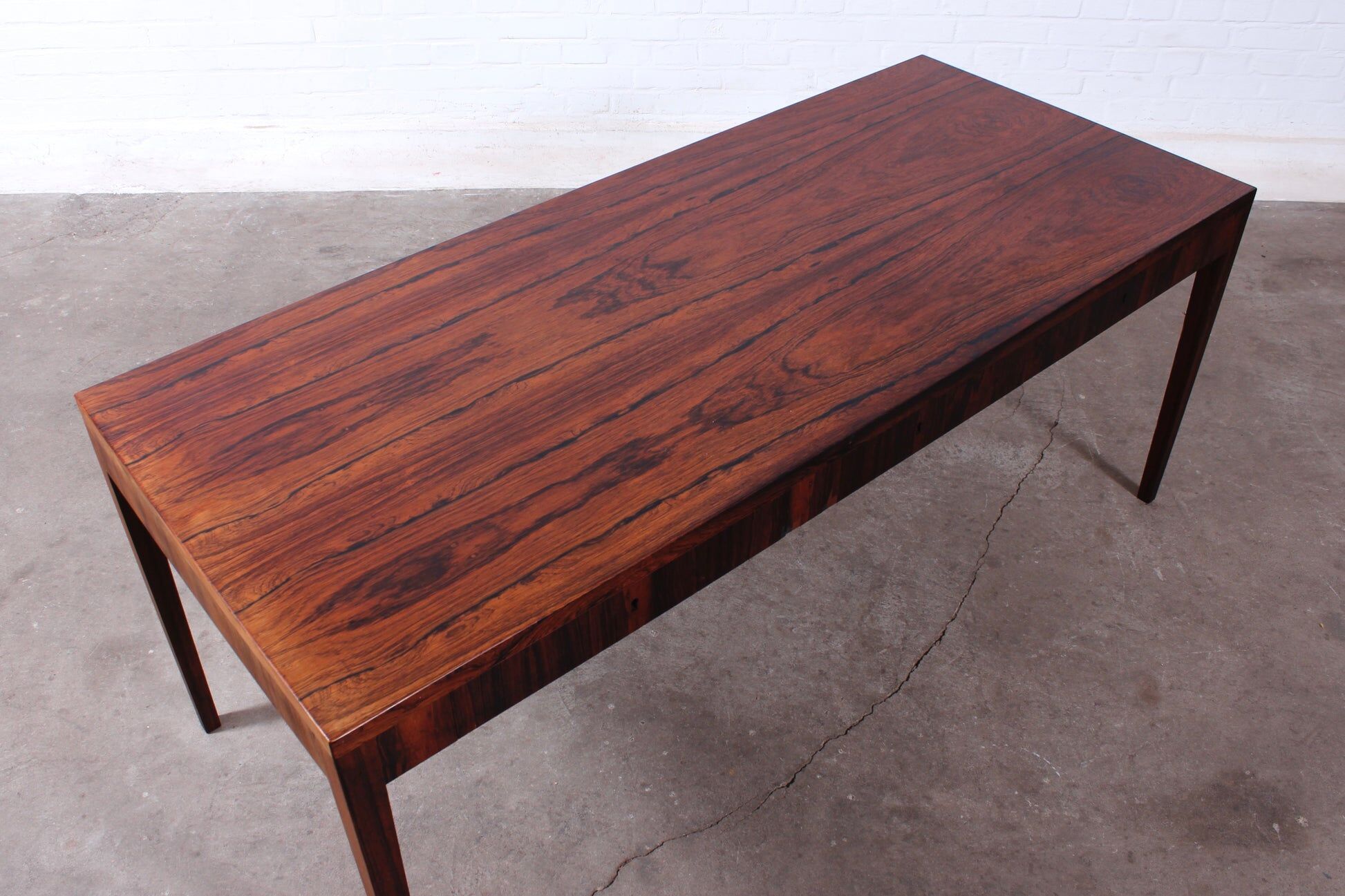 Minimalist rosewood desk by Riis Andersen