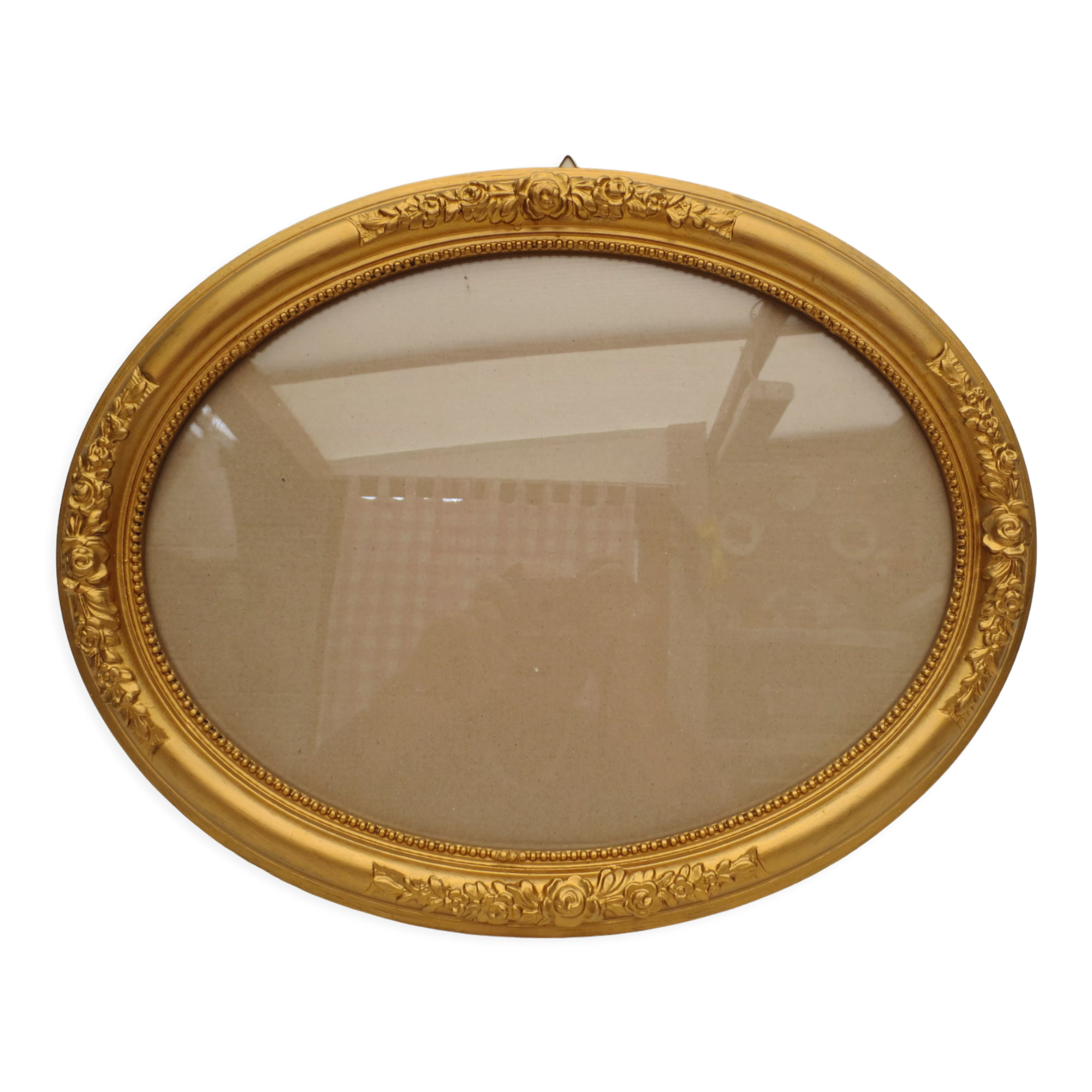 Large old oval gilded wooden frame and stucco decorations