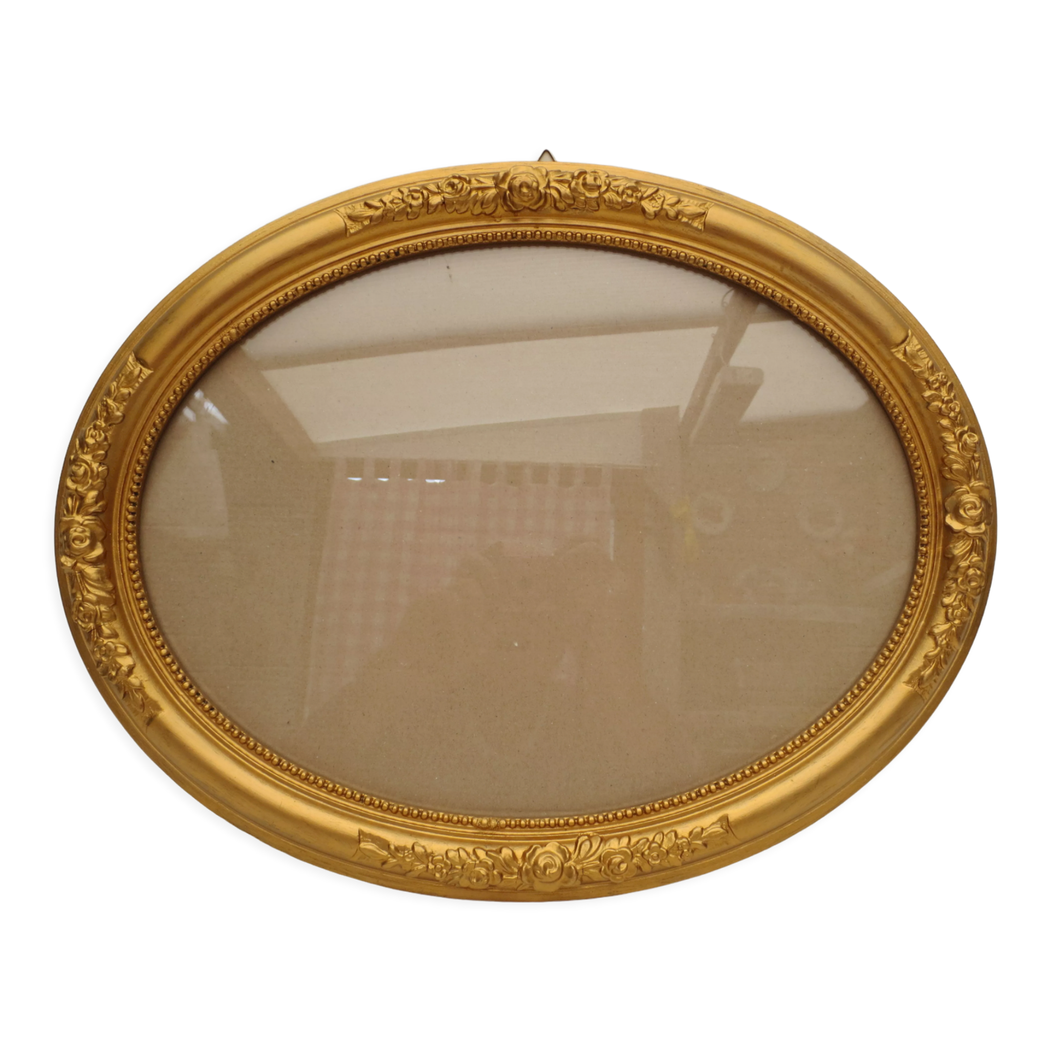Large old oval gilded wooden frame and stucco decorations