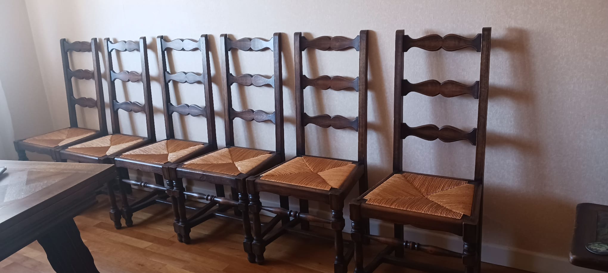 6 wooden and straw chairs