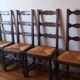 6 wooden and straw chairs