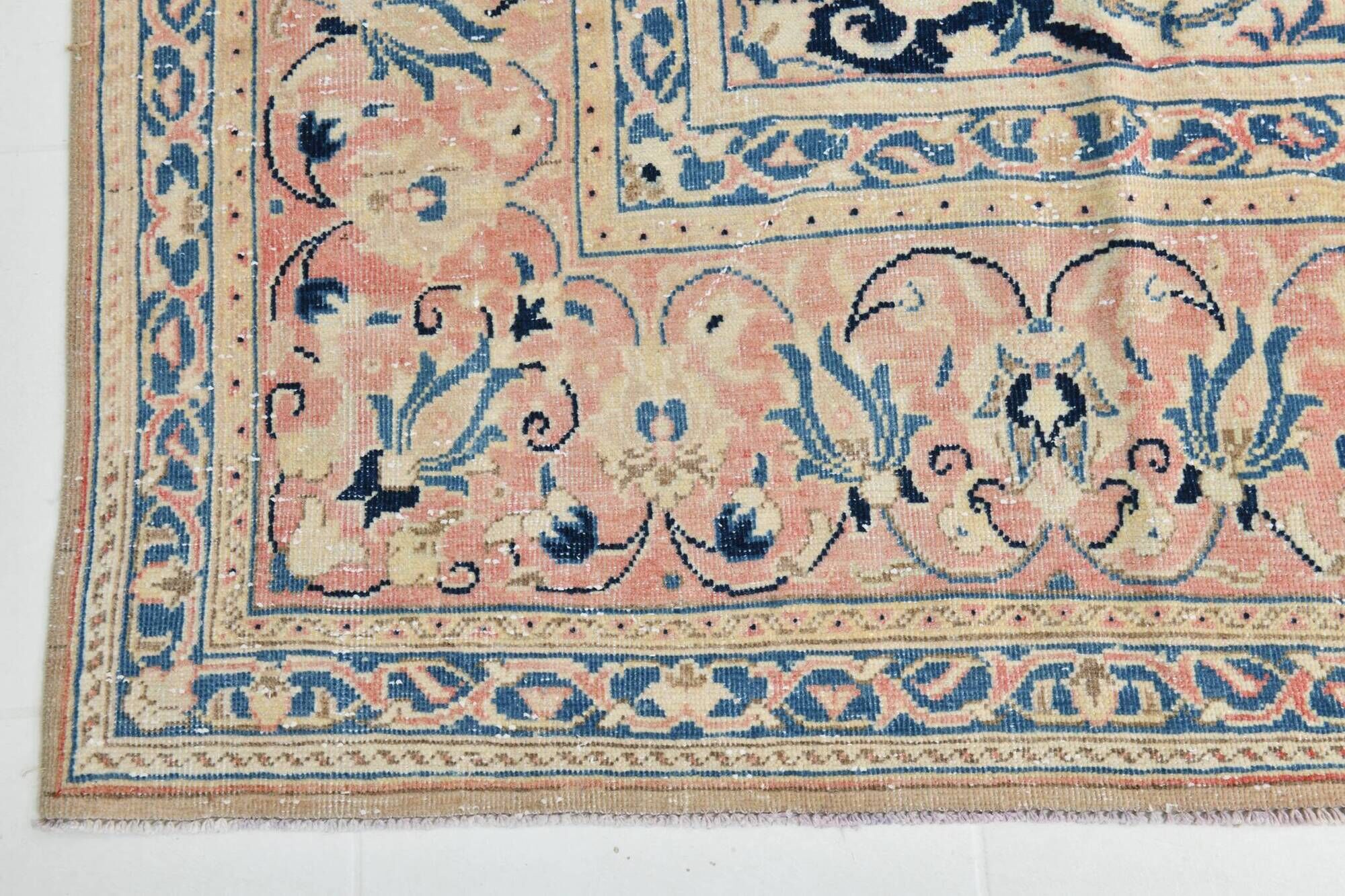 Antique Turkish wool rug in faded floral patterns, 10 x 13 feet.