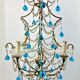 Italian chandelier with blue beads and gilded wood.