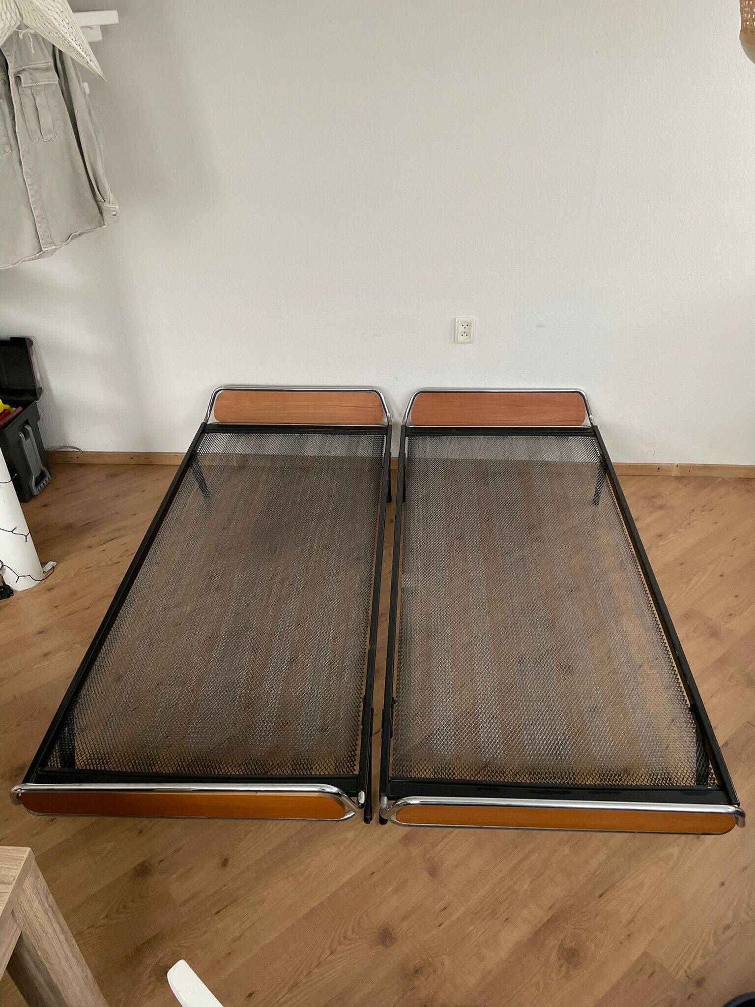 Pair of teak and chrome beds with mattress