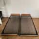 Pair of teak and chrome beds with mattress